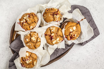 Berry oatmeal muffins on a white background, top view. Healthy vegan dessert.