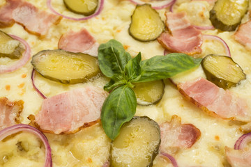 pizza with bacon and pickled cucumbers