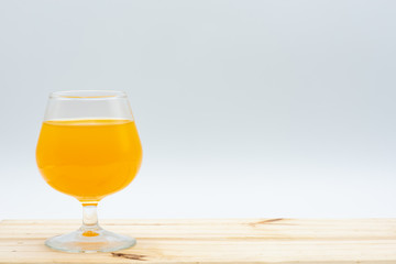 One glass of orange juice on a table