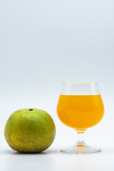 Orange juice in glass and organic orange