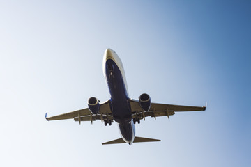 big commercial airplane at landing with clear blue sky background
