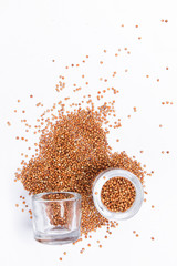 top view of a different beans and seeds near in a glass jar on a white background