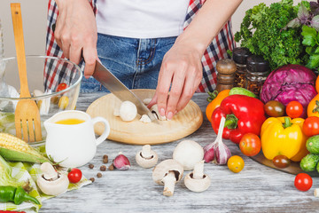 Woman cooks at the kitchen
