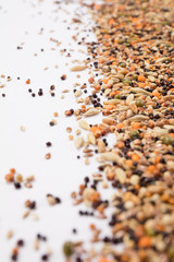 Top view close up of a different beans and seeds on a white background