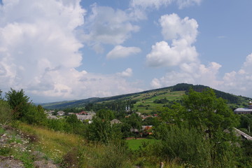Obraz premium mountain slopes green trees and mountains