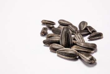 Obraz premium Macro view of natural organic sunflower seeds on background