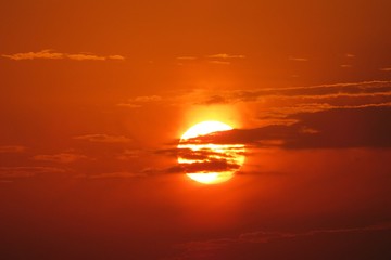 Beautiful orange fiery sunset, the sun sets over the horizon 