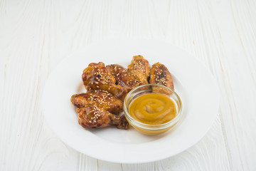 fried chicken wings and mustard sauce