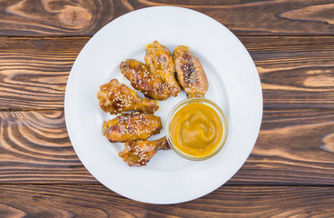 chicken wings and mustard sauce, top view