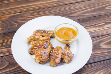 fried chicken wings and mustard sauce