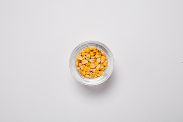 Macro view of natural organic corn beans on background
