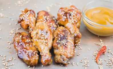 chicken wings and mustard sauce, close-up