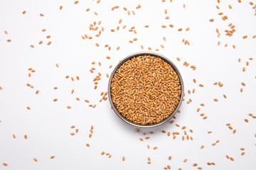 Macro view of natural organic wheat grain beans on background