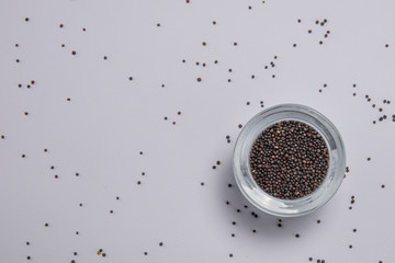 Macro view of natural organic rape seeds on background