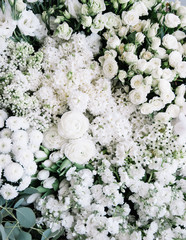 Beautiful fresh blossomy flower bed of fresh flowers at the florist shop (Ranunculus, lilac, roses,...