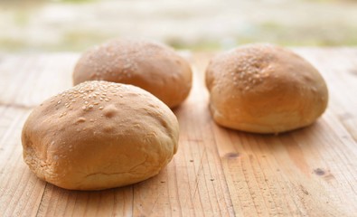 Burger buns on wooden table. selective focus