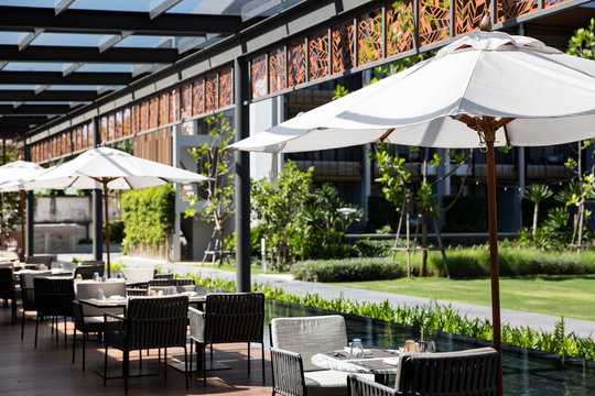 Outdoor Lounge And Restaurant Near By The Pool And Garden View