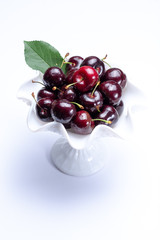 Giant fresh ripe black cherries, new harvest, ready to eat close up