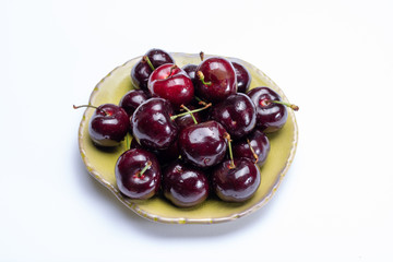 Giant fresh ripe black cherries, new harvest, ready to eat close up