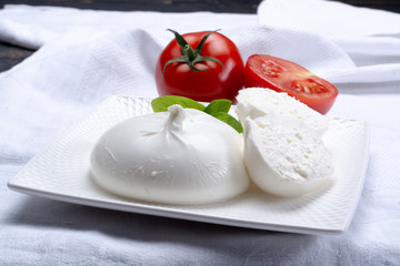 Fresh soft white burrata, ball buttery cheese, made from a mix of mozzarella and ricotta cream,...