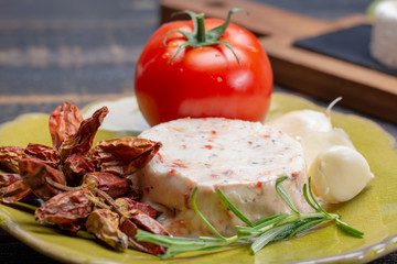 French soft cheeses, variety of different taste goat milk natural cheeses on granite plate close up sesrved as dessert