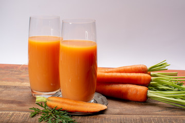 Tasty healthy natural sweet vegetable drink, fresh organic carrot juice ready to drink in glass