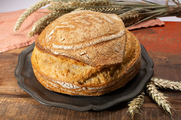 Sourdough homemade round white wheat bread close up