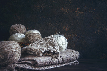 Tubes of wool thread and knitting needles for knitting handmade hobby in Scandinavian style...