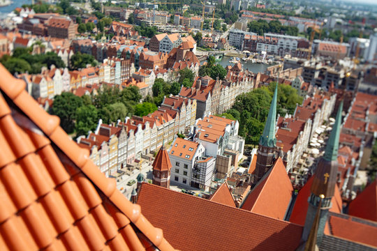 Townscape  with red roofs in old city Gdansk made from top, aerial landscape with tilt-shift lens
