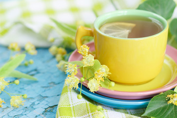Cup of herbal tea with linden blossoms and lemon