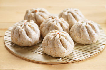 Chinese steamed bun on wooden basketwork
