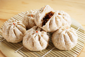 Chinese steamed bun on wooden basketwork