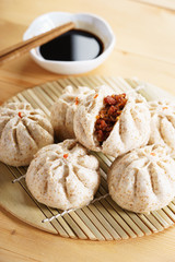Chinese steamed bun on wooden basketwork
