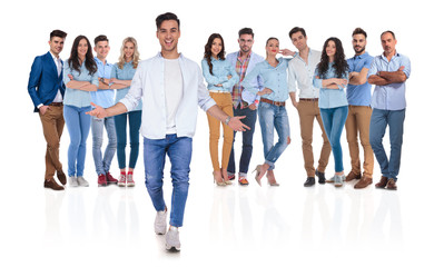 Fototapeta premium casual group leader welcomes you with open hands in team