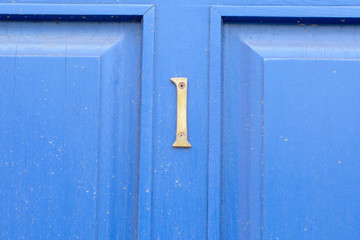 House number 1 sign on blue door