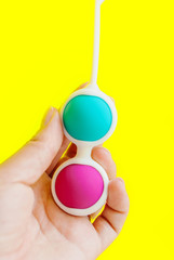 Color Kegel balls, Geisha balls in yellow background