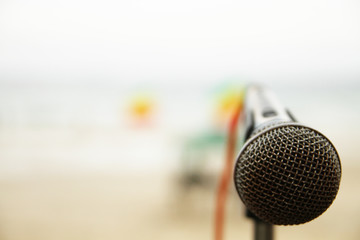 close up microphone on blurred beach background