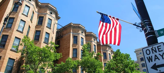 Zelfklevend Fotobehang Us flag in a street of Chicago  © Brad Pict