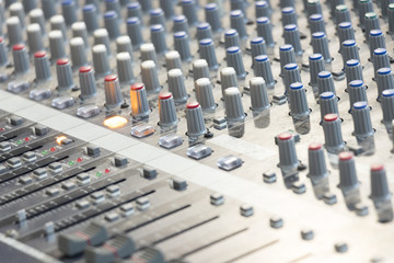 Professional audio mixing console with faders and adjusting knobs,TV equipment and selective focus