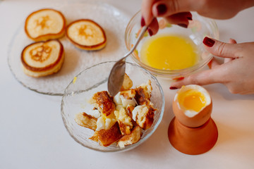 Traditional breakfast. Pancakes stuffed with egg yolk and warm melted butter