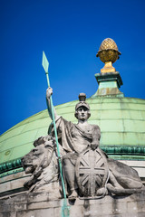 Britannia, personification of Britain, holding a Union Jack Shield, spear and the protection of a lion. London UK. © Alex Yeung