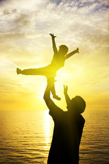 Silhouettes of father and son.