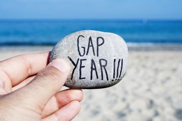 man on the beach and text gap year