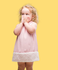 Beautiful blonde toddler gesturing