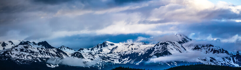 beautiful sunset and cloudsy landscape in alaska mountains