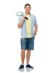 sport, leisure and people concept - smiling young man with badminton rackets over white background