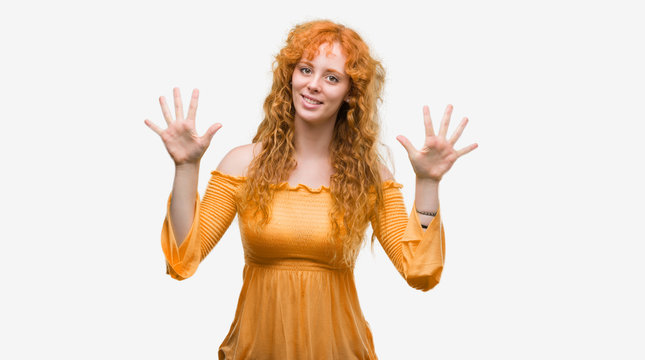 Young redhead woman showing and pointing up with fingers number ten while smiling confident and happy.