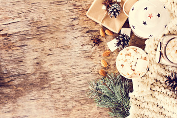 gift, fir branch, nuts, cones, Cocoa, coffee, cozy knitted blanket. Winter, New Year, Christmas still life