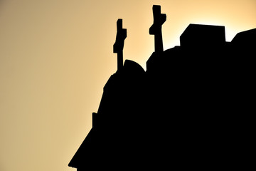 Silhouettes of the top of the tombs in the cemetery