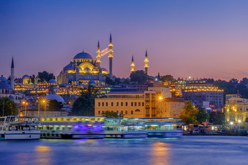 Fototapeta premium July 20, 2018, Sunset in Istanbul, Turkey. View of the Suleymaniye Mosque and Eminony Pier